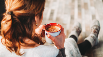 Home Woman With Coffee Cup And Socks